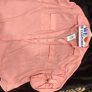 New blouse has small pin size stain. New, never worn